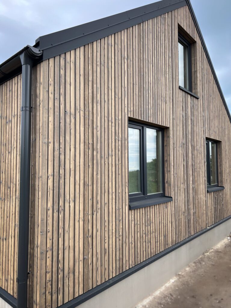 charred spruce cladding medeksa sand